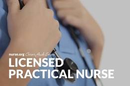 Confident nurse wearing scrubs holding onto stethoscope