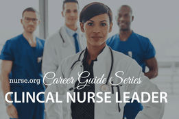 Female healthcare professional in front of nurses and doctor