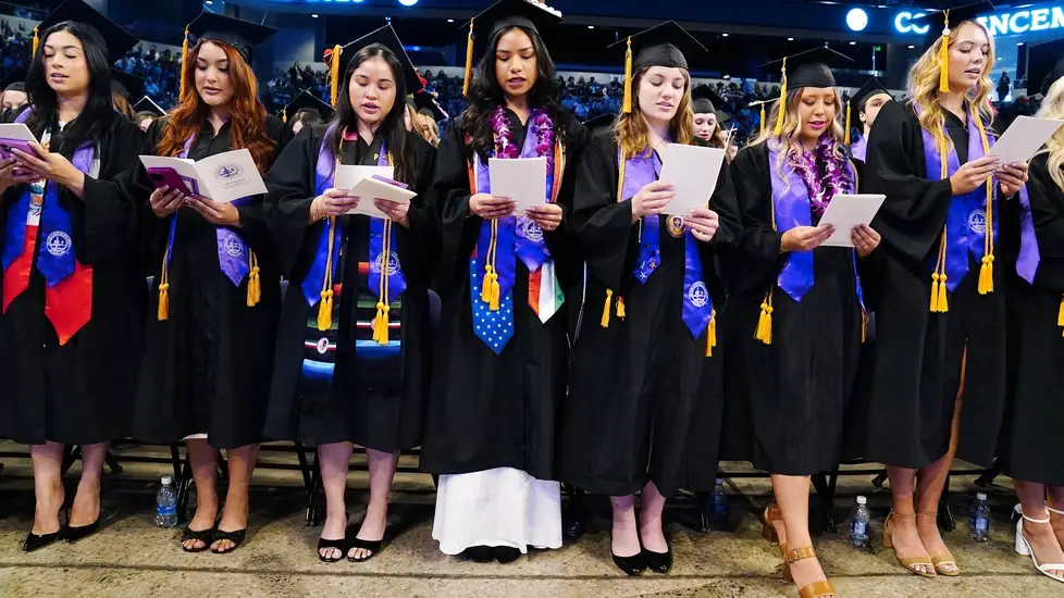 GCU nursing graduates recite the Florence Nightingale Pledge at the 2025 winter commencement ceremony.