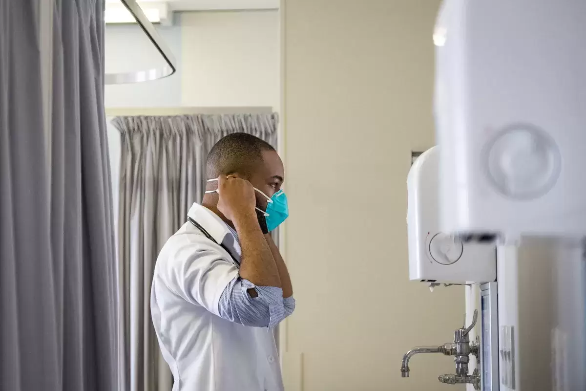 Young male healthcare worker wearing a protective mask