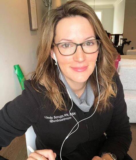 Nurse linda in a branded sweatshirt on video chat