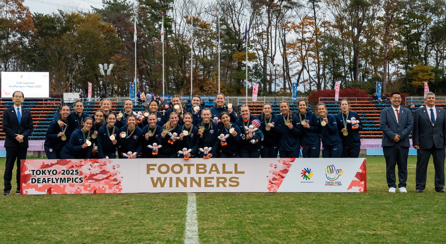 U.S. women’s Deaf national soccer team stands together on the field after winning the football title at the 2025 Deaflympics in Tokyo.